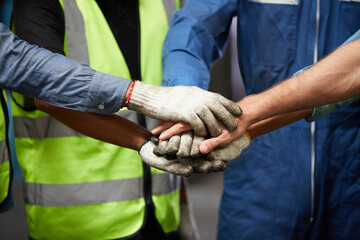 workers joining hands for cooperation success work and project in the factory