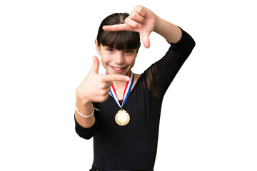 Little caucasian girl with medals over isolated background focusing face. Framing symbol