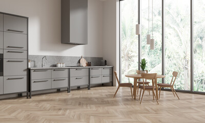 Stylish home kitchen interior with eating table and chairs, panoramic window