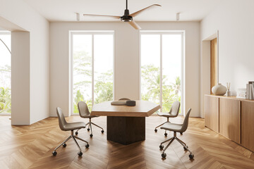 Stylish home meeting room interior with table and seats, panoramic window