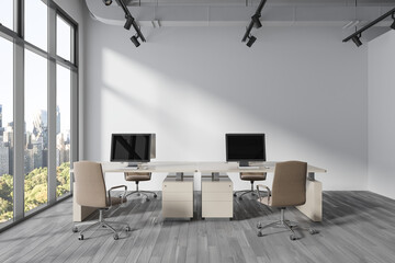 Cozy office room interior with pc computer on table in row, window. Mock up wall