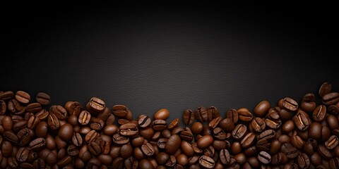 Caffeine delight. Fresh coffee beans on black background