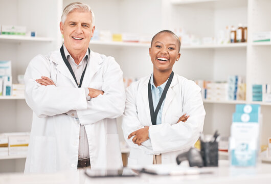 Portrait, smile and arms crossed for pharmacy with a team in a drugstore for healthcare or treatment. Medical, collaboration or teamwork with a man and woman pharmacist happy a dispensary together