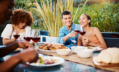 Happy, friends and cheers with wine glass at restaurant, bonding and having fun. Smile, alcohol and group of people toast at dinner party, celebration and drink, eating food and together at table