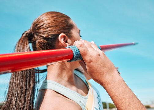 Woman, javelin and olympic athlete in sports competition, practice or training in fitness on stadium field. Active female person or athletic competitor throwing spear, poll or stick in distance