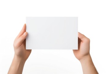 a hand holding a white paper