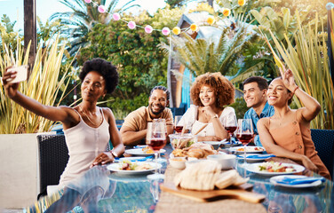 Friends in selfie at lunch in garden, food and wine at happy event with diversity in outdoor bonding together. Photography, men and women at dinner party table, people eating with drinks in backyard.
