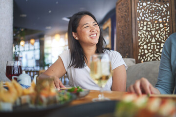 Japanese woman, sushi restaurant and smile for eating, thinking and conversation for fine dining at party. Asian friends, fish and healthy with culture, traditional or fast food in diner, bar or shop