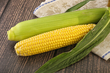 Yellow sweet raw cob corn