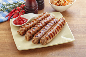 Grilled sausages with cabbage and sauce