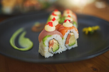 Sushi restaurant, catering and plate in closeup for service, lunch and dinner for Philadelphia roll, chopsticks and fish. Japanese cuisine, platter and food in cafe, luxury and eating for nutrition