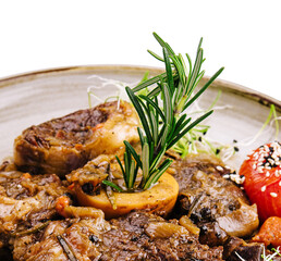 Grilled bbq steaks with fresh herbs and tomatoes