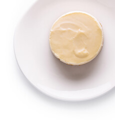 Fototapeta na wymiar Lemon meringue tart on white plate top view