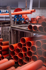 industrial photo of plastic water pipes lying in a warehouse