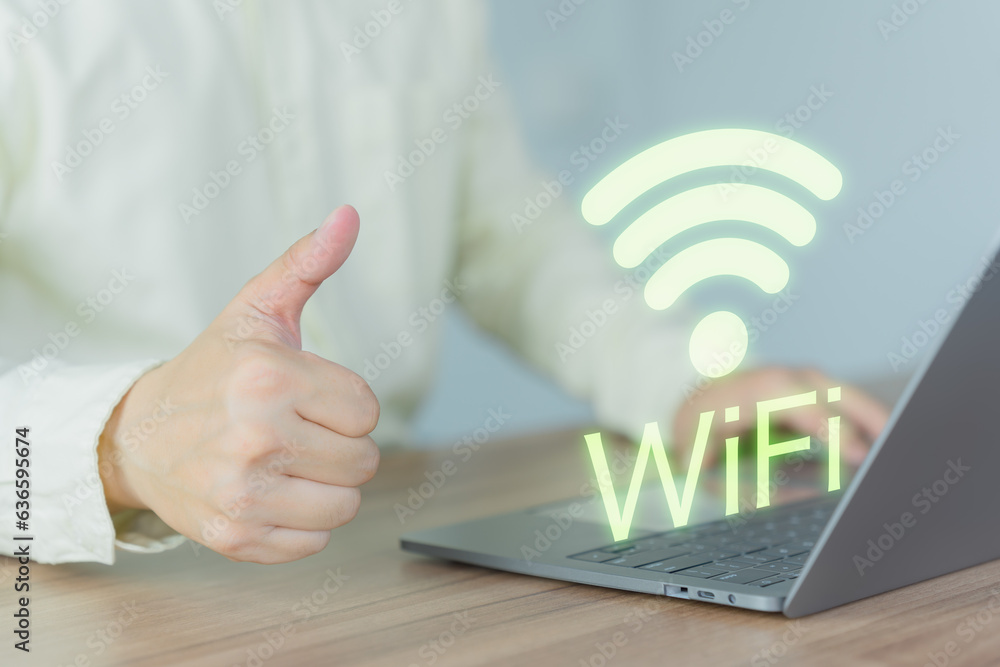 Poster Young man searching and connect for wifi on his a computer laptop in the cafe. Concept of technology connectivity and connection problems to wifi by computer.
