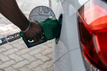 Petrol Pump Attendant Filling Fuel to Car