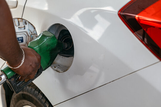 Petrol Bunk Attendant Pouring Petrol to Car
