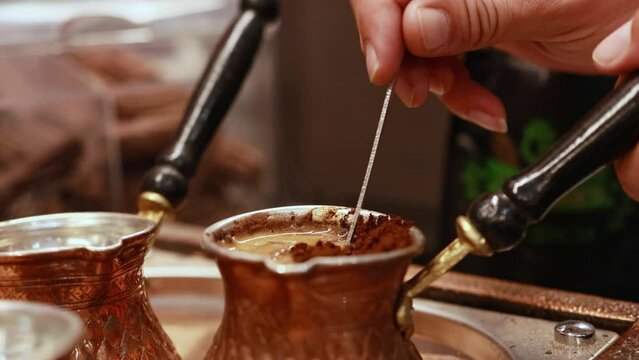 Making coffee on the sand in a traditional way