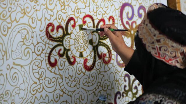 Making batik tulis Borneo. The technique of making batik by writing using a canting tool. Canting consists of nyamplung, cucuk, gagang or handles made of copper, bamboo and wax