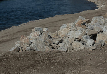 stone shoring on the river bank