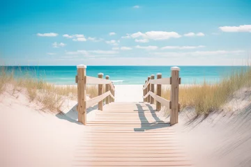 Printed kitchen splashbacks Descent to the beach Wooden boardwalk leading to a beach. Light-colored wood, railings, dune grass. Ocean and blue sky in the background. Bright and sunny mood.