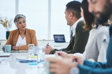 CEO, mature woman or business people in meeting planning in discussion with vision or mission together. Collaboration, leadership or mentor talking about project ideas in agency to team of employees