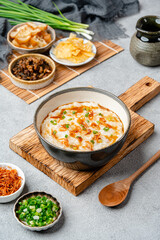 Rice porridge or congee with cakwe in bowl