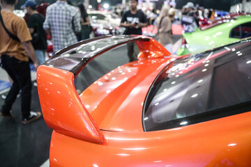 shows the rear wing of the orange car