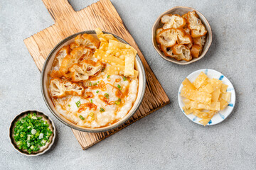 Rice porridge or congee with cakwe in bowl