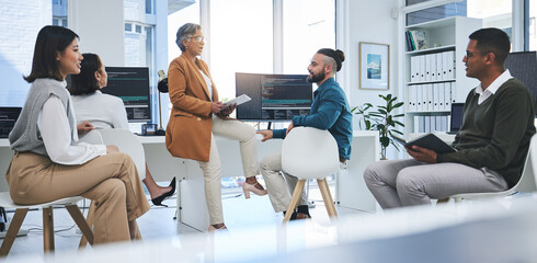 Software, mentor and programmer with business people in office for coding, developer or information technology. Meeting, code review and feedback with employees in digital agency for it cybersecurity