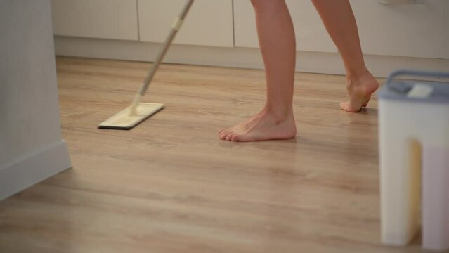 Wet cleaning of the house, mopping, clean laminate flooring