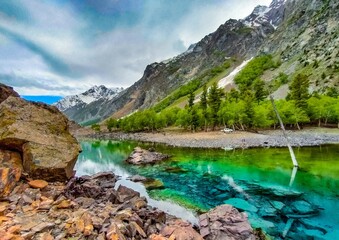 colorful lake and the mountains under sky