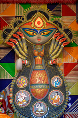 Idol of Goddess Devi Durga at a decorated puja pandal in Kolkata, West Bengal, India. Durga Puja is...