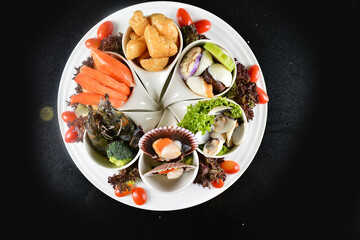 iced mixed raw seafood platter scallop, fish, crab, clam, shell, prawn, beancurd, oyster in bowl...