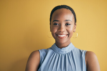 Face, happy and black woman, designer and entrepreneur in studio isolated on a yellow background...