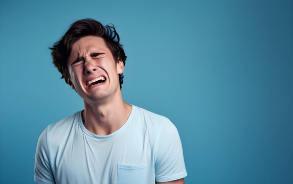 Closeup Portrait Photo Of Young Crying Attractive Caucasian Man With Unhappy Sad Face, Problem, Depressed, Offended Isolated On Modern Pastel Blue, Pink Color Background, AI Generated