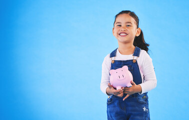 Girl child, piggy bank and studio portrait with mockup space, saving and financial education by...