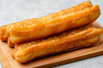 Youtiao or Yu Char Kway is a long golden-brown deep-fried strip of wheat flour dough of Chinese origin