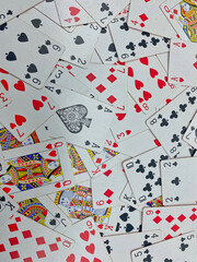 Playing cards spread out on a table