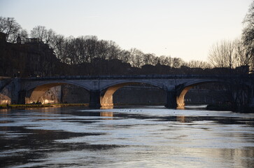 bridge over the river at sunset