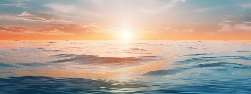 A blurry image, a banner, the sun rising over the sea in the style of a bokeh panorama.
