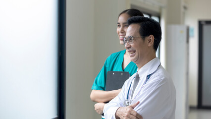 Doctor and nurse stand together with confident making patient comfortable with medical treatment solution