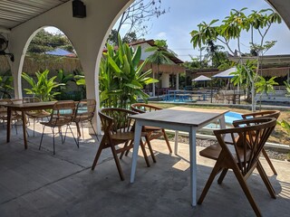 Close up of tables and chairs in sunny cafe. lifestyle, interior design, coffee and local business.