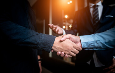 Cooperation executive businessman in suit shaking hands gesture together in meeting conference successful professional agreement discussing deal trust being partnership reaching achievement unity