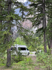 A Van camping in Kicking Horse Campgraound in Yoho National Park in Canada.