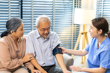 Obraz premium Portrait of smiling caring asian nurse service help support discussing and consulting taking care with senior elderly asian man and woman couple at home visit.senior retirement home care concept