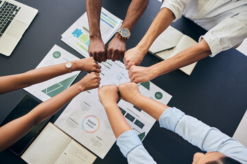 Fist circle, business people and documents with group, teamwork and planning at startup, office or top view. Team building, hands and synergy with link, connection or paperwork for start in workplace