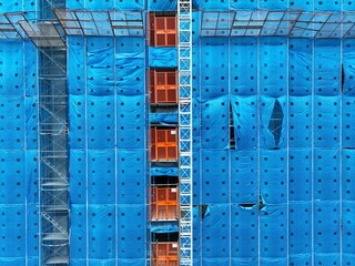 Electric elevator in construction site.