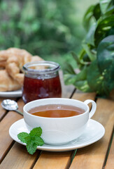 Cup of tea with fresh mint leaves