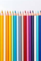 Close up of colorful Pencils lined up in front of a white Background. School Backdrop with Copy Space
